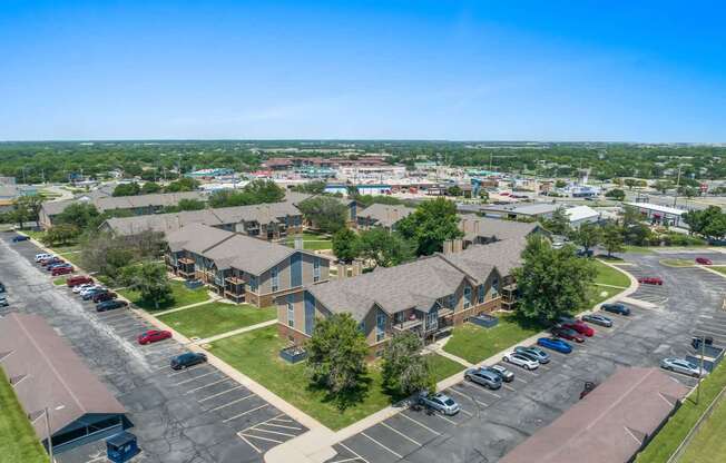 an aerial view of a neighborhood of houses in a parking lot