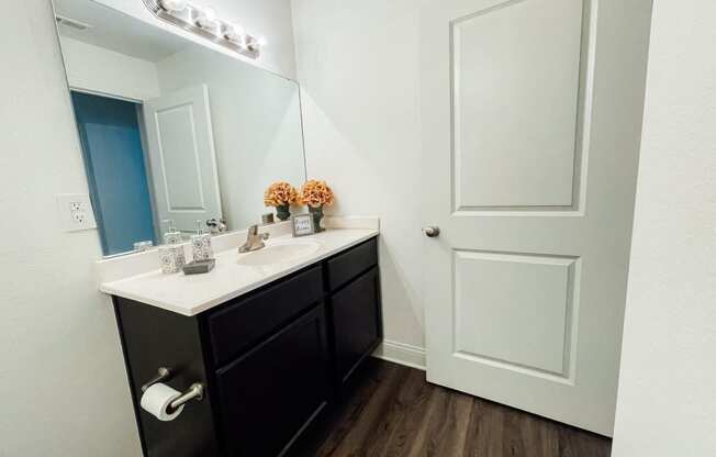 an empty bathroom with a sink and a mirror