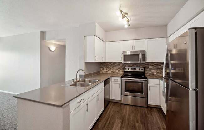 spacious kitchen with stainless steel appliances at Dakota Ridge apartments