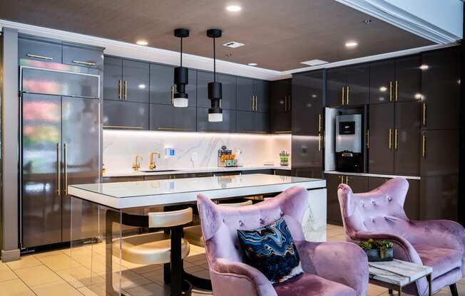 a modern kitchen with a white counter top and black cabinets