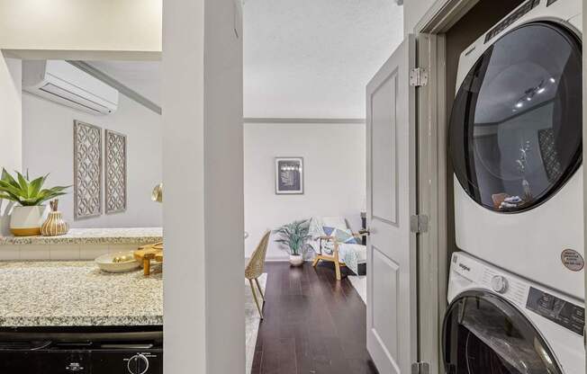A laundry room with a washer and dryer in it.