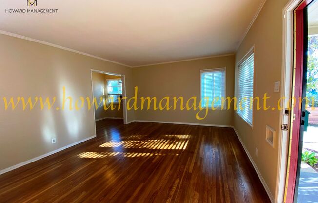 Lovely home with extra large backyard, converted garage and hardwood floors!