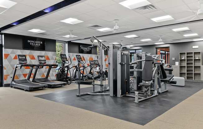 a gym with cardio machines and other exercise equipment