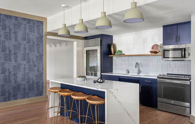 A modern kitchen with a bar area and a blue backsplash.
