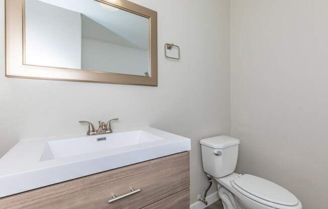 a bathroom with a sink and toilet in a 555 waverly unit