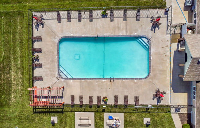 Aerial View Of The Pool & Sundeck With Lounge Chairs
