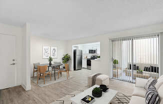 Model Living Room with Wood-Style Flooring and Patio Accessibility at Horizon Apartments located in Santa Ana, CA.