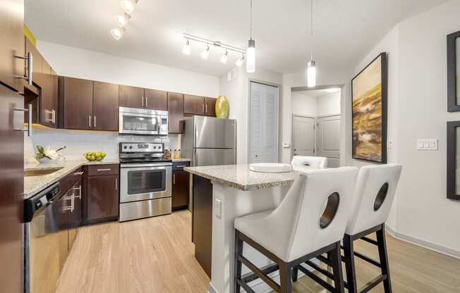 our spacious kitchen and dining room are equipped with stainless steel appliances and granite countertops