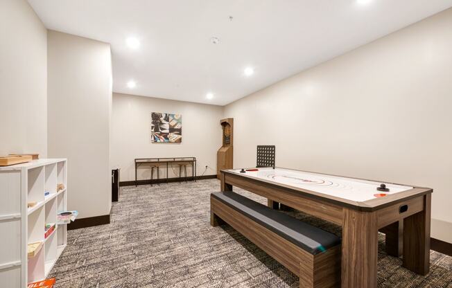 a games room with a ping pong table