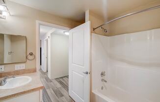 a bathroom with a shower and a sink