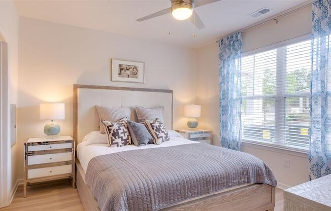 Furnished bedroom with walk-in and oversized closet at The Station at Savannah Quarters apartments for rent in Pooler, GA