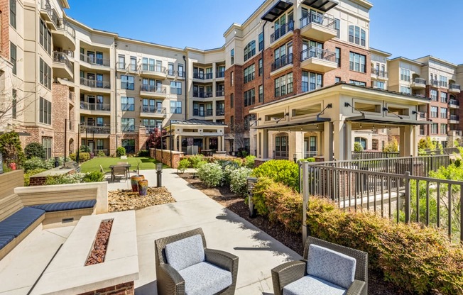 the preserve at ballantyne commons apartments patio with chairs and landscaping