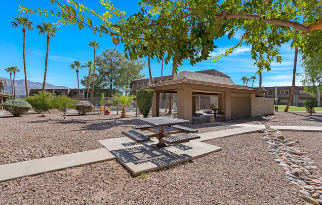 a view of a courtyard with trees and a building at Verde Apartments