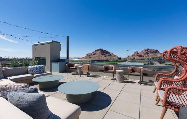 Roof top lounge with view of red-rock mountains