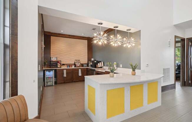 A reception area with a white and yellow reception desk.