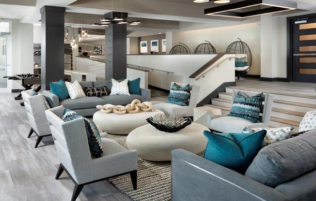 a living room filled with furniture and a staircase