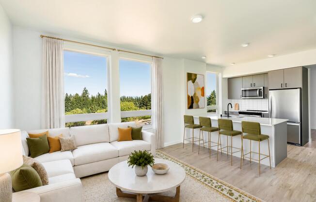 Premium homes feature oversized windows, expansive open-concept layouts, quartz kitchen islands with generous seating, and elevated views that bring natural beauty indoors.