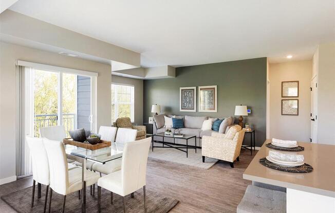 A dining room with a glass table and chairs.