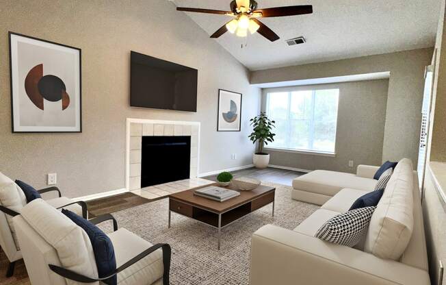 a living room with white furniture and a ceiling fan