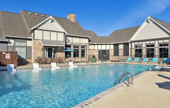 the preserve at ballantyne commons pool and building with lounge chairs