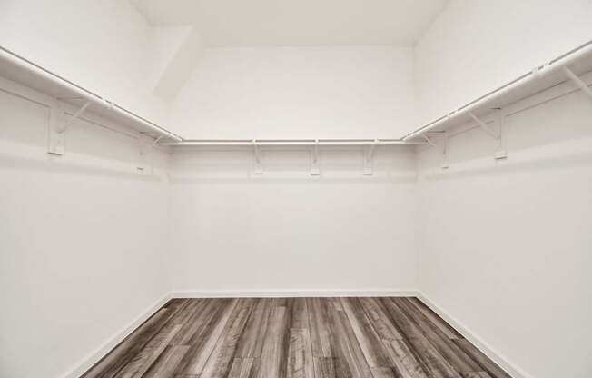 A room with white walls and wooden flooring.