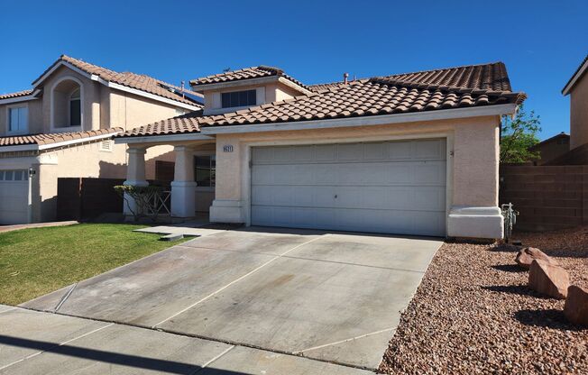Single story home with tile and granite countertops.