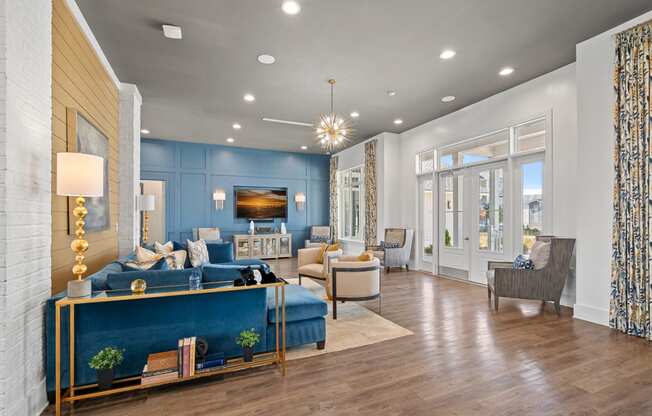 a living room with blue walls and a wood floor