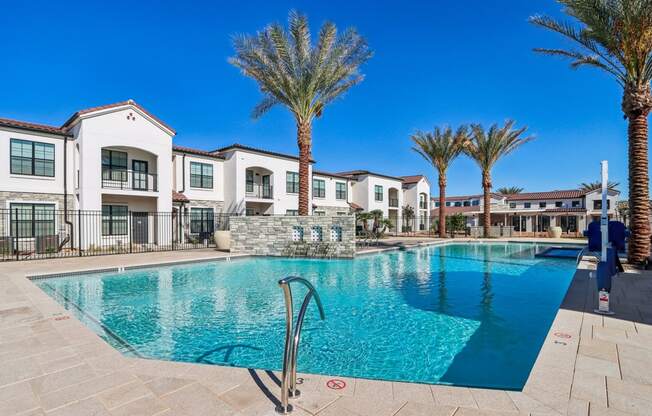a swimming pool at a resort with palm treesat Stella, San Tan Valley, AZ 85143