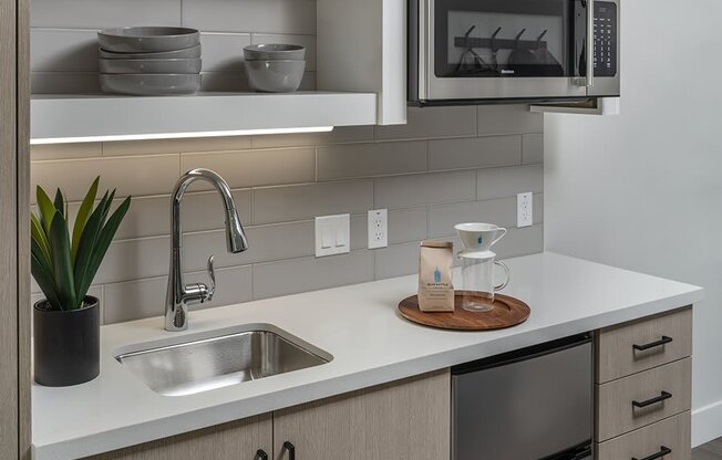 a kitchen with a sink and a microwave