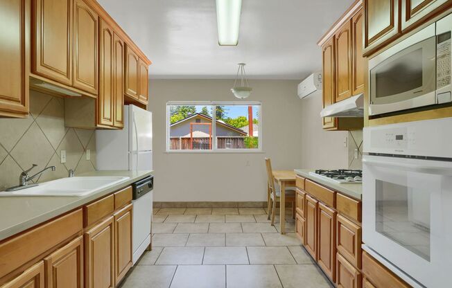 Charming 2 Bed 1 Bath Duplex Unit with Beautifully Landscaped Backyard