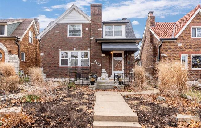 This charming gingerbread home in St. Louis Hills blends modern updates with classic appeal.