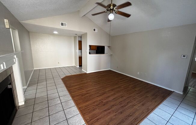 Open Concept, Wood burning fireplace with Ceramic Flooring