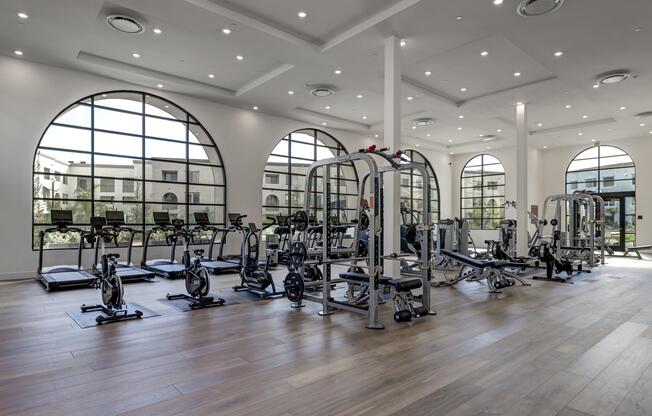 a room filled with furniture and a large window