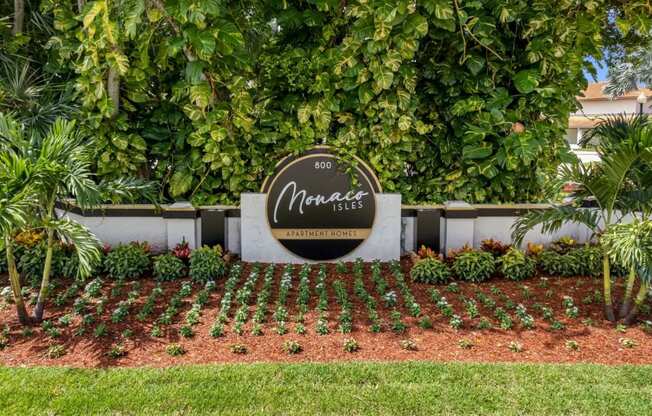 the sign is in front of the front yard of a house