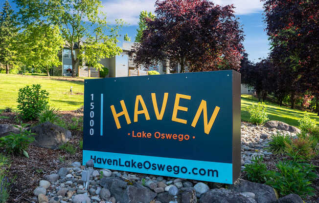 A sign for Haven in Lake Oswego stands in front of a landscaped area.