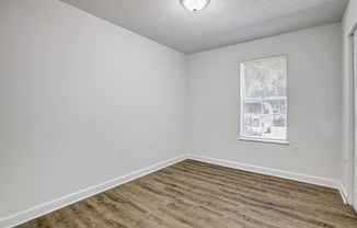 Chelsea Apartments in Gainesville Florida photo of bedroom with hardwood flooring