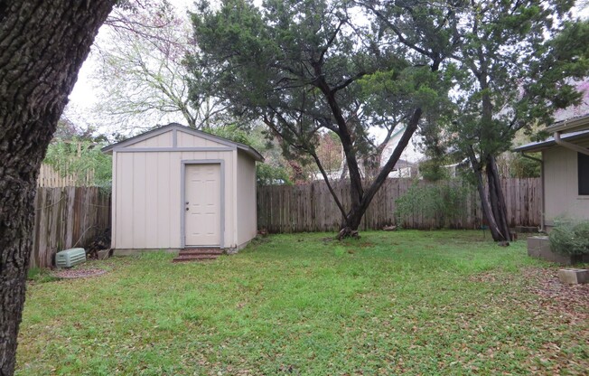 Established one story 3/2/2 on tree covered lot!
