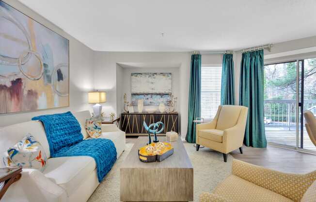 a living room with a white couch and a coffee table at Madison Brookhaven, Georgia