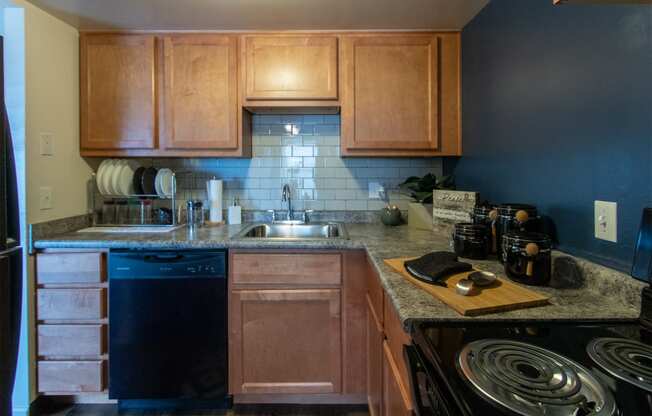 This is a picture of the kitchen in an upgraded 980 square foot, 2 bedroom, 1 bath model apartment at Fairfield Pointe Apartments in Fairfield, Ohio.