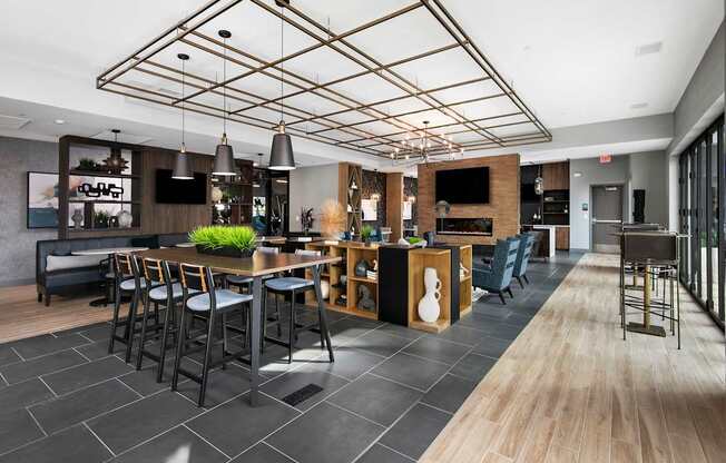 A modern kitchen with a bar area and seating.