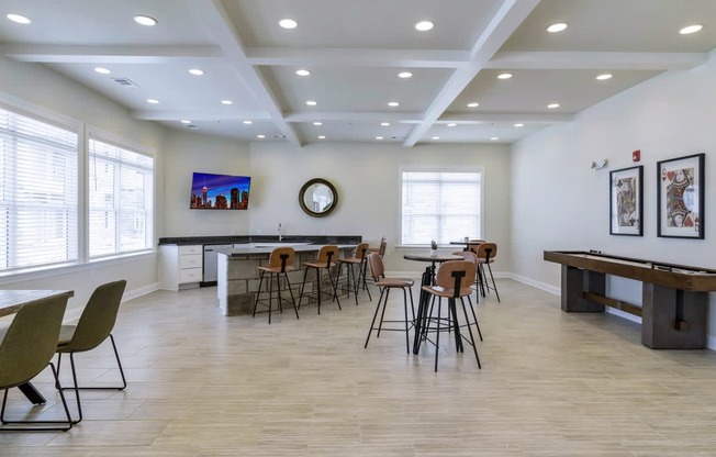 Ashland Farms Resident Clubhouse Game Room with Table Seating, TV, and Shuffleboard