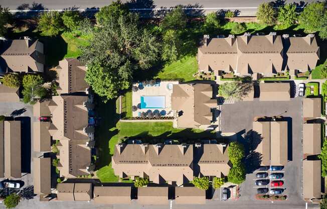 arial view of a neighborhood with houses and a pool
