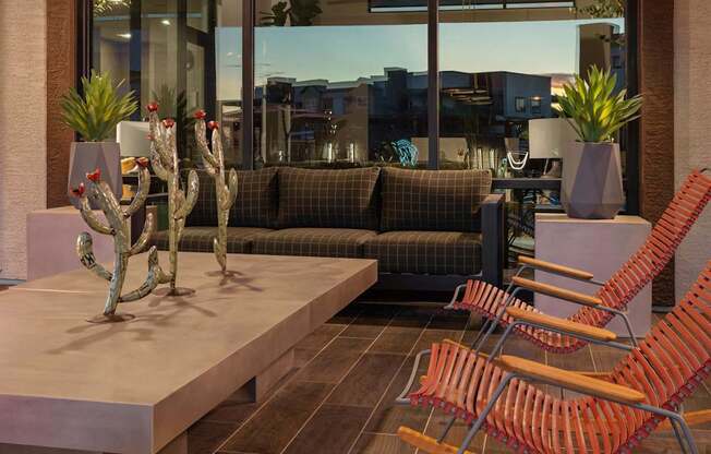 the lobby of a hotel with chairs and a coffee table at Weylyn Luxury Apartments, Laveen, Arizona
