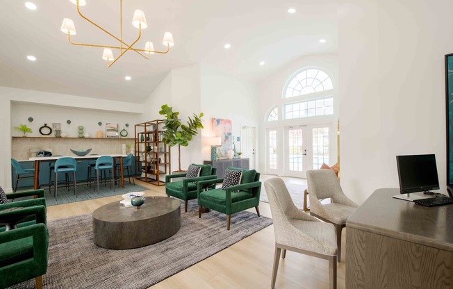 A modern living room with a green sofa and a wooden coffee table.