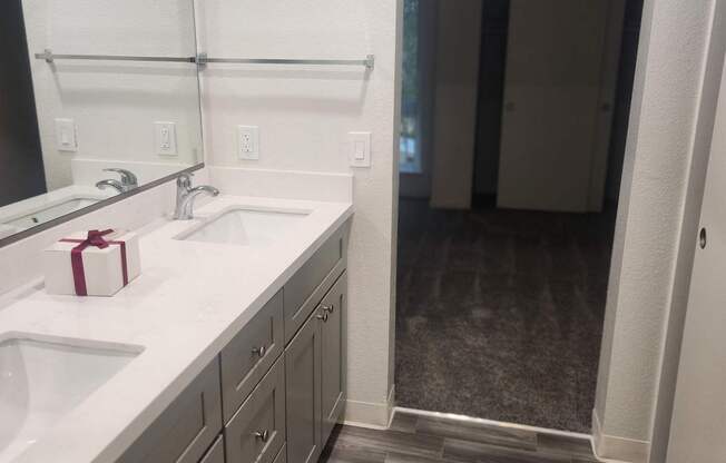 A modern kitchen with a white countertop and a microwave above it.