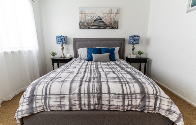 an overview of a bedroom with a bed and a window
