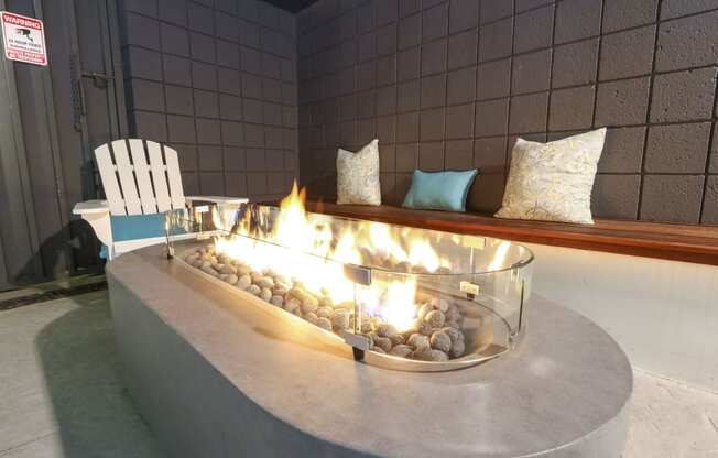 Pool side fire pit table at Westwood Riviera Apartments, California