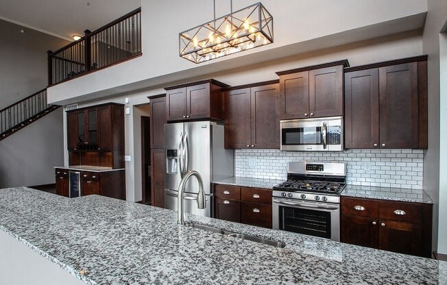 Designer Kitchen Equipped with Stainless Steal Appliances & Designer Cabinetry