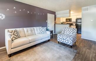 a living room filled with furniture and a bed