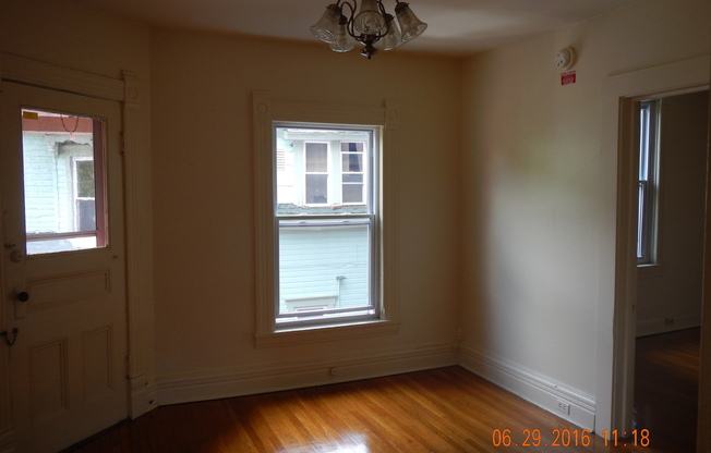 AVAILABLE 7/1/25 - Charming Second Floor Apartment One Block From Shops, Eateries and Bus lines